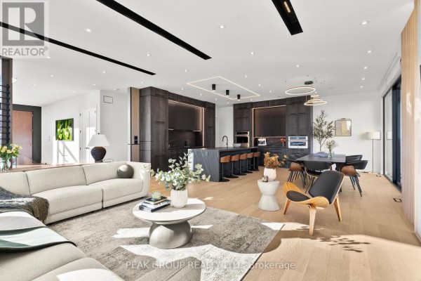 Bedroom with bed, nightstands, art, and window - 111 Millpond Road Niagara On The Lake