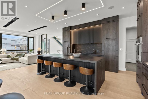 Modern home with garage, large windows, and concrete driveway - 111 Millpond Road Niagara On The Lake