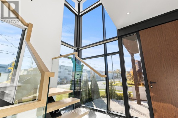 Modern kitchen with island and dining area - 111 Millpond Road Niagara On The Lake