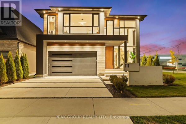 Modern patio with grill, seating, fire pit, and heater - 111 Millpond Road Niagara On The Lake