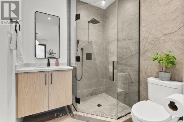 Modern home with glass entryway and stone facade - 111 Millpond Road Niagara On The Lake