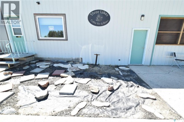 Close-up of the landscaping and entryway to the commercial building. - 111 Railway Avenue N, Middle Lake