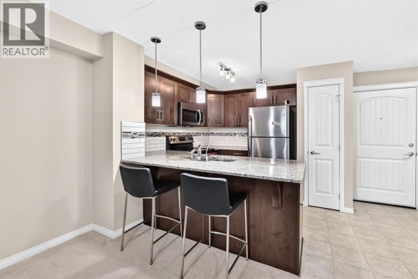 Living room - 1110, 130 Panatella Street Nw, Calgary, AB T3K0Y6 Photo 3