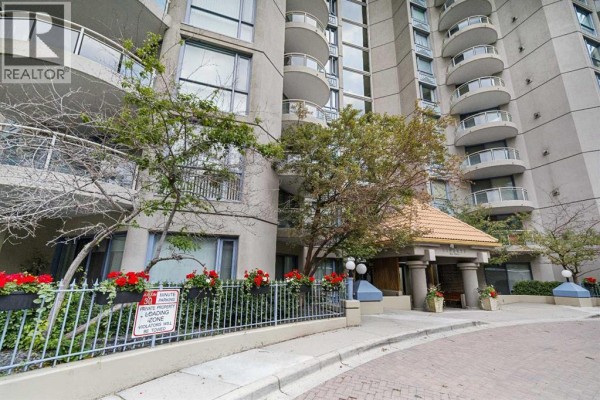 Exterior view of the building with balconies and decorative flower planters. - 1110, 804 3 Avenue Sw, Calgary