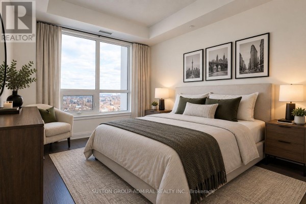 Primary bedroom with a king-size bed, two nightstands, and a sitting chair. - 1114 - 7900 Bathurst Street, Vaughan
