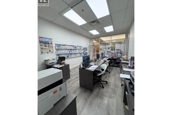 Interior of a small room with white walls, a sink, white cabinets, and electrical panels on the wall. - 1115 4540 No. 3 Road, Richmond