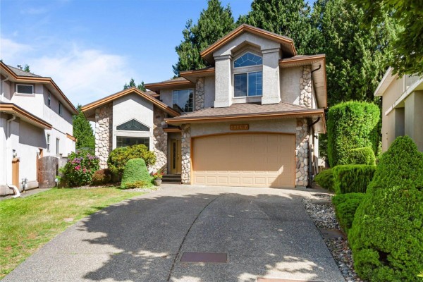 Entryway with hardwood flooring, leading to dining area and staircase - 11167 160a Street, Surrey
