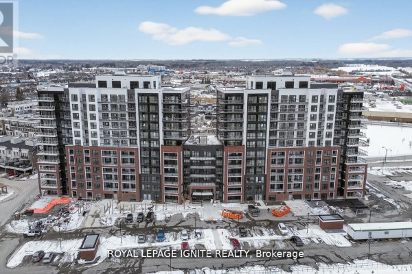 Front view of a twin-tower apartment complex with snow on the ground. - 1118 - 51 Clarington Boulevard, Clarington