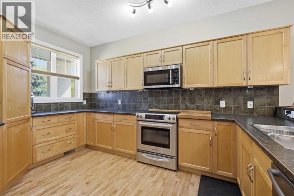 Laundry room - 112, 1000 Glenhaven Way, Cochrane, AB T4C1Y9 Photo 5