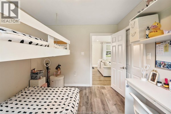 Bedroom with bunk beds, desk, ring light, and shelving - 112 Clovelly Tecumseh
