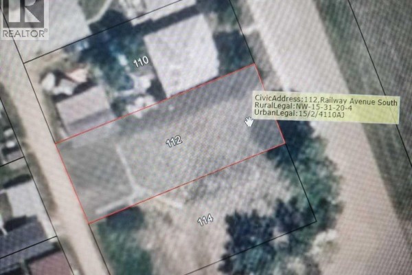 Aerial view of lot 112, with civic and legal information displayed. - 112 Railway Avenue S, Morrin
