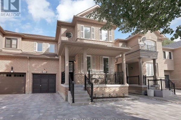 Front view of a modern brick townhouse with multiple balconies and a covered porch. - 112 Southbrook Crescent, Markham
