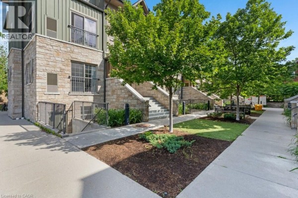 Pathway leading to the entrance of 112 Union Street E Unit# B103 with stairs and landscaping. - 112 Union Street E Unit# B103, Waterloo