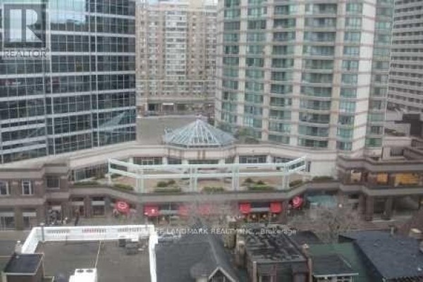 View of Bay Street buildings and a multi-level retail complex. - 1122 - 633 Bay Street, Toronto