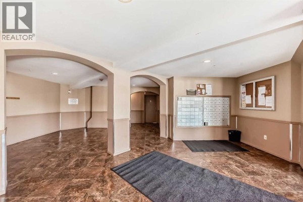 Living room - 1125, 60 Panatella Street Nw, Calgary, AB T3K0M1 Photo 4