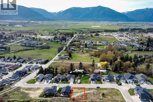 Aerial view of vacant lot outlined in red, surrounded by residential properties. - 1126 12th Avenue N, Creston