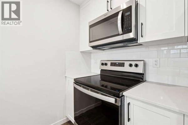 Kitchen - 113, 40 Livingston Parade Ne, Calgary, AB T3P2K4 Photo 3