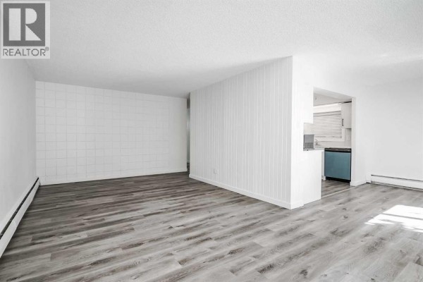 Living room - 113, 6919 Elbow Drive Sw, Calgary, AB T2V0E6 Photo 4