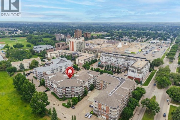 Aerial view of the apartment building near a shopping center and main road. - 113 106 Armistice Way, Saskatoon