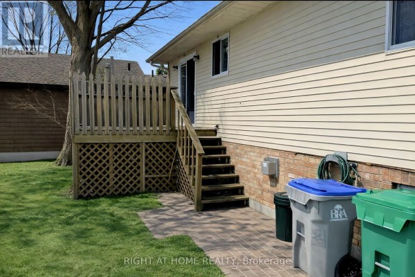 Wooden deck with stairs leading to the back entrance of the house - 113 Anglesea Street, Goderich)