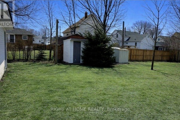 Spacious backyard with a storage shed and fenced perimeter - 113 Anglesea Street, Goderich)
