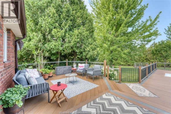 Deck with seating, coffee table, rugs, and plants - 113 Beach Court Stoney Point