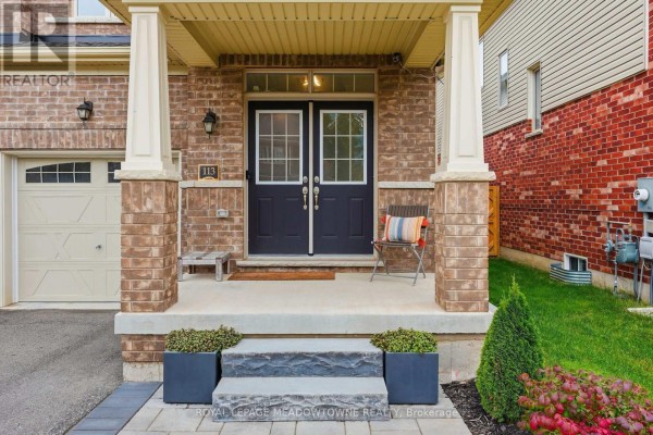Close-up of a townhouse front entrance with double dark doors and stone steps. - 113 Taylor Avenue, Guelph/eramosa