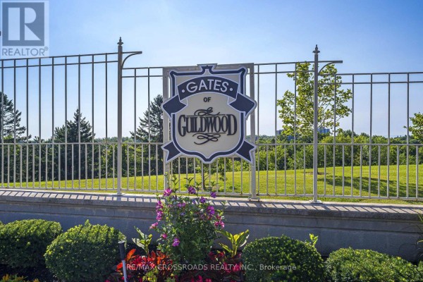 Sign indicating The Guild Gardens & Waterfront Park is 2 km away. - 1132 - 10 Guildwood Parkway, Toronto