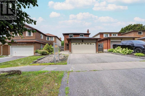 Exterior view of 1132 Cedarcroft Crescent, Pickering, featuring a brick facade and garage. - 1132 Cedarcroft Crescent, Pickering