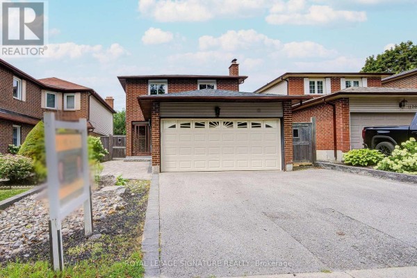 Front exterior of the house at 1132 Cedarcroft Crescent with a double garage door. - 1132 Cedarcroft Crescent, Pickering