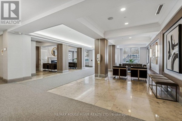 Entrance hallway with mirrored closet doors and tile flooring. - 1136 - 125 Omni Drive, Toronto