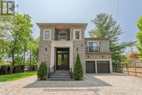 Stone house with double doors, balcony, and two-car garage - 1138 Garden Road Mississauga