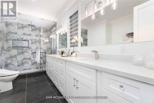 Modern double vanity with marble countertop, walk-in shower, and toilet - 1138 Garden Road Mississauga