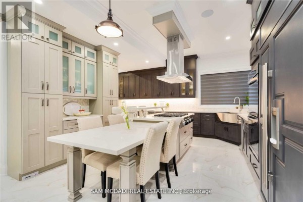 Modern kitchen with island, farmhouse sink, and custom cabinets - 1138 Garden Road Mississauga