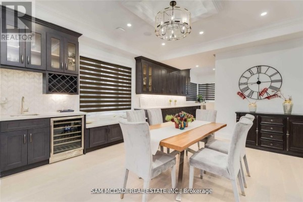 Dining room with wine fridge, bar, and dining table for six - 1138 Garden Road Mississauga