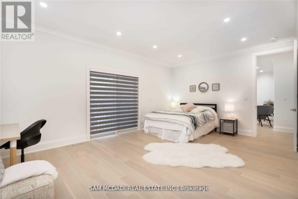 Bedroom with modern blinds, bed, and desk - 1138 Garden Road Mississauga