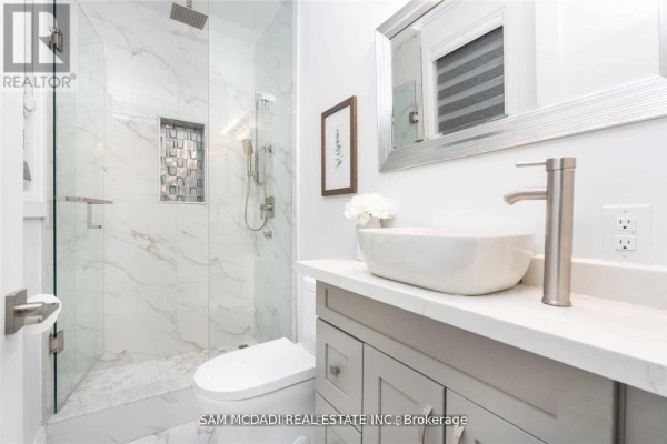 Modern bathroom with marble tile shower, vessel sink, and vanity - 1138 Garden Road Mississauga