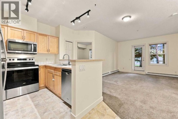 Living room/Dining room - 114, 1414 17 Street Se, Calgary, AB T2G5S6 Photo 5