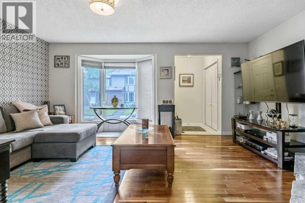 Living room - 114, 6103 Madigan Drive Ne, Calgary, AB T2A5K9 Photo 2