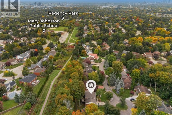 Aerial view showing the property at 114 Frederick Banting Place near Regency Park and a school. - 114 Frederick Banting Place, Waterloo