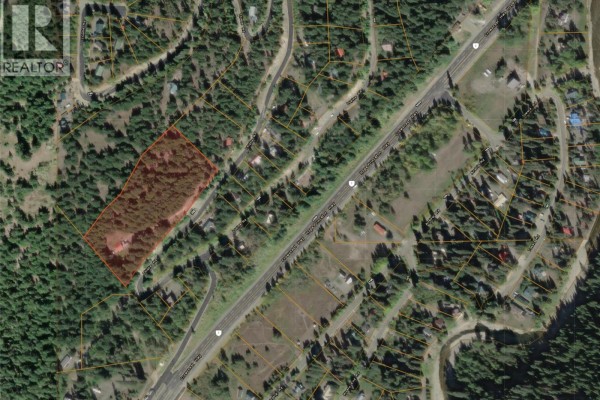Aerial map showing a property lot outlined in red, surrounded by dense forest and neighboring houses near a road. - 114 Thistle Road, Princeton