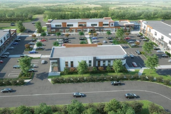 Aerial view of a commercial development with multiple buildings and ample parking. - 1140, 76 Cornerstone Heights Ne, Calgary