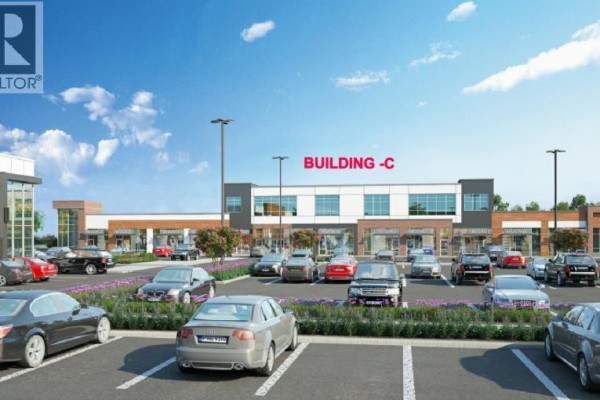 Exterior of Building C, a commercial property with storefronts and a parking lot. - 1140, 76 Cornerstone Heights Ne, Calgary