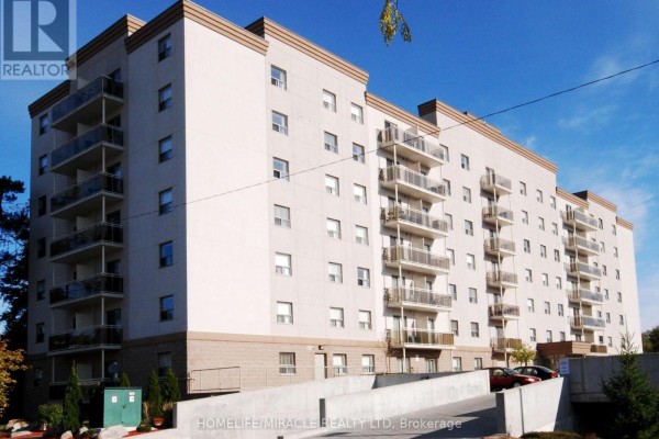 Side view of the apartment building showing multiple balconies and windows. - 115 - 736 Old Albert Street, Waterloo