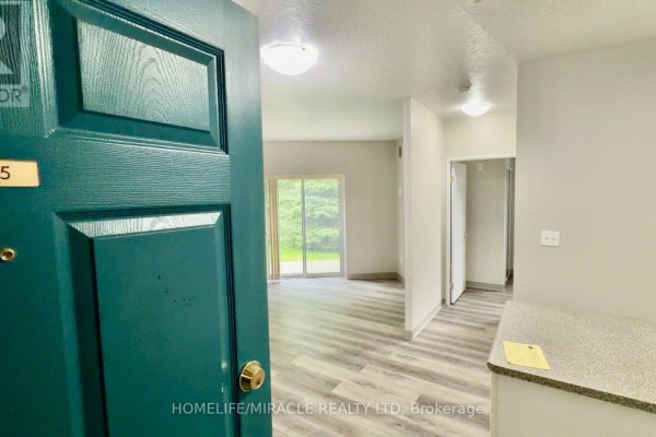 View from the open front door into the living room and hallway. - 115 - 736 Old Albert Street, Waterloo