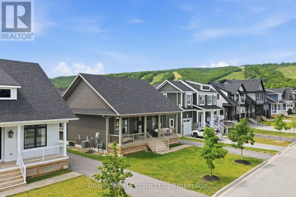 Street view of houses with pitched roofs and grey siding, some with porches. - 115 Black Willow Crescent, Blue Mountains