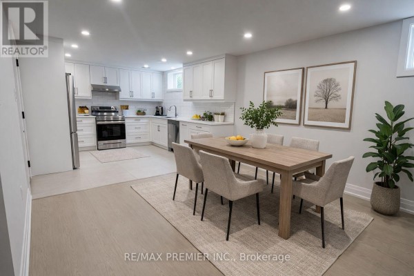 Dining area with wooden table, upholstered chairs, and open-concept kitchen view. - 115 Mapes Avenue, Vaughan
