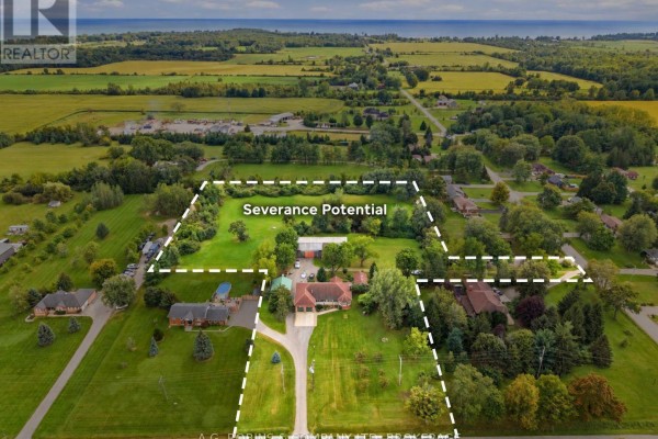 Aerial view of a rural property with a house, barn, outbuildings, and marked boundaries. - 11573 3 Highway, Wainfleet
