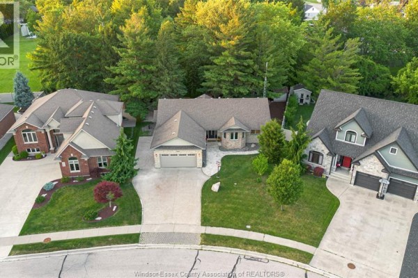 Aerial view of houses on a suburban street with a distant view of Lake Erie. - 1160 Jillian, Lakeshore