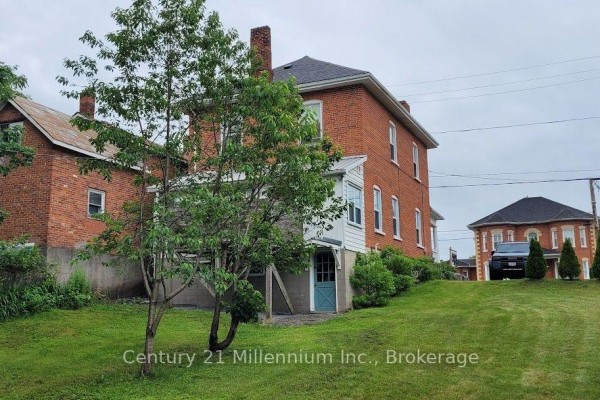 Bright bedroom with four-poster bed, chandelier, and large windows - 117 Durham Street S, Centre Hastings